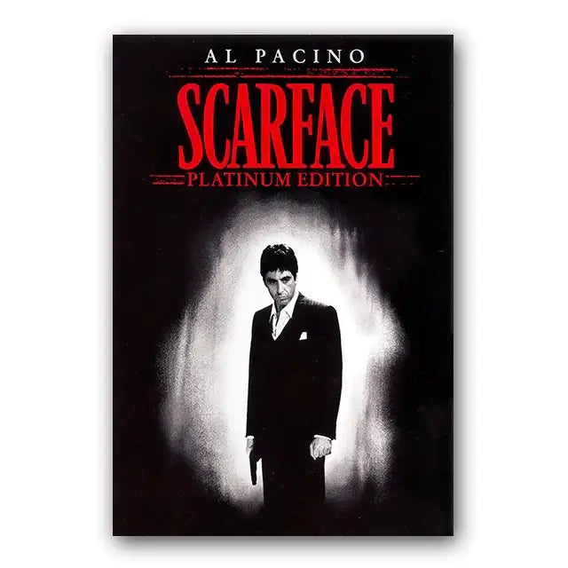 Black and white scarface tony montana canvas wall art print with al pacino in dark suit and red title text by decorbites