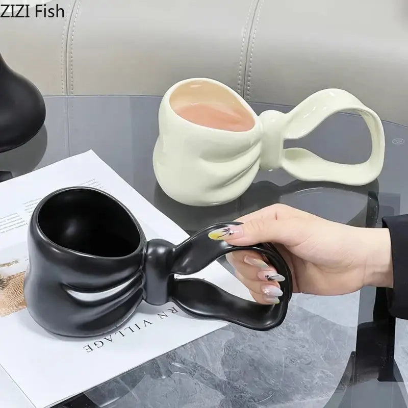 Black ceramic coffee mug with glossy finish shaped like a bowknot decorbites bowknot ceramic coffee cup
