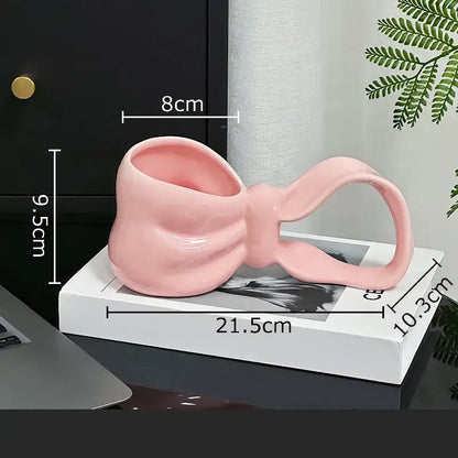 Glossy pink decorbites bowknot ceramic coffee mug shaped like a bowknot for kitchen tea and coffee use