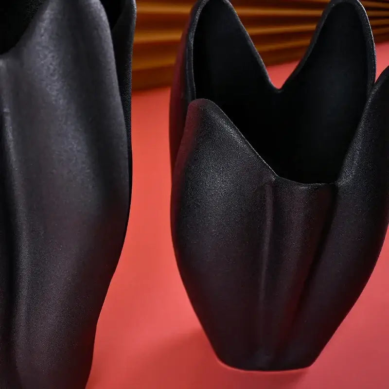 Black texture ceramic vase with matte finish and sculpted petal design for decorbites living room decor
