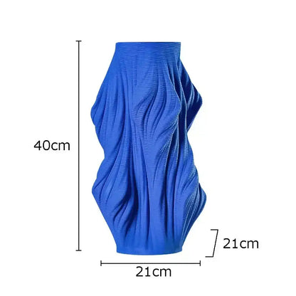 A vibrant blue decorbites ceramic vase with sculpted flowing ribbed texture for bedroom decorbites ceramic vase set