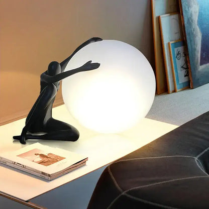 Sculptural black table lamp with red glass ball and glowing white globe ideal for decorbites glass ball bedroom decor