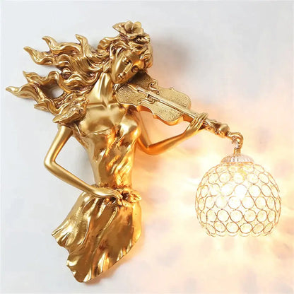Sculptural gold violinist crystal wall lamp with ornate globe shade featuring a flowing hair woman wall sconce
