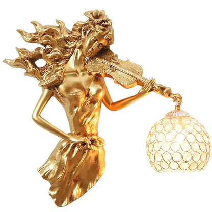 Golden sculptural violinist wall lamp with ornate crystal globe as a crystal wall lamp living room sconce