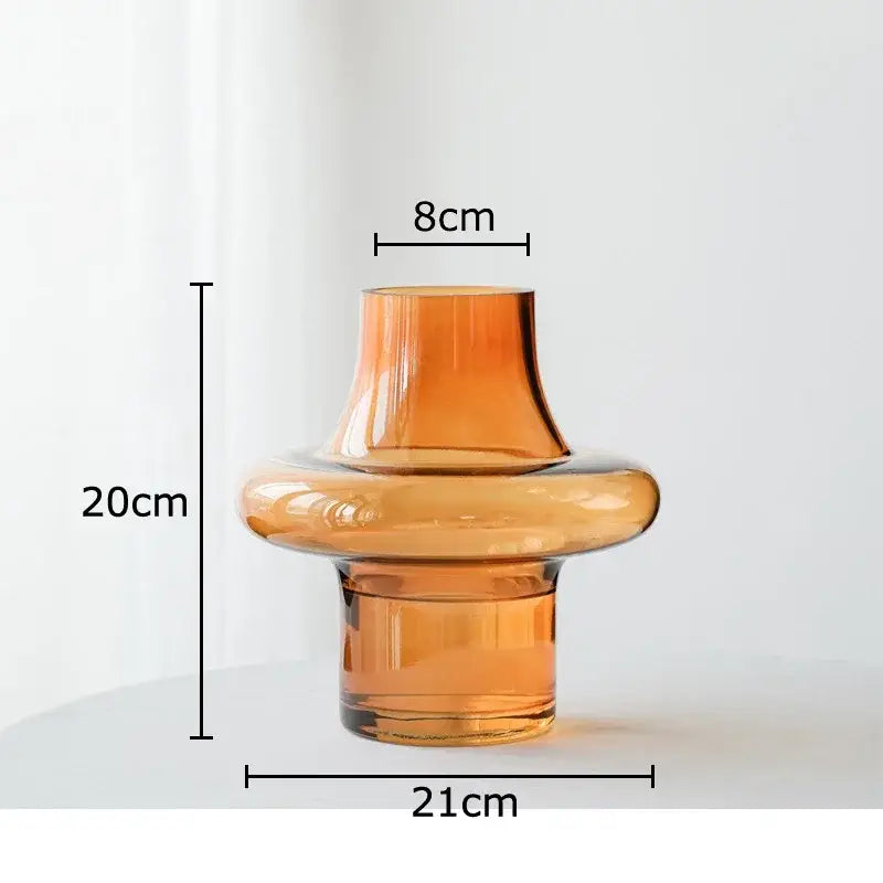 A sleek tiered amber glass vase with smooth curves and wide base ideal for living room decor by decorbites amber glass
