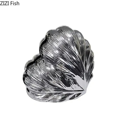 Shiny silver shell-shaped heart feather ceramic tissue box with intricate ridged texture for decorbites decor