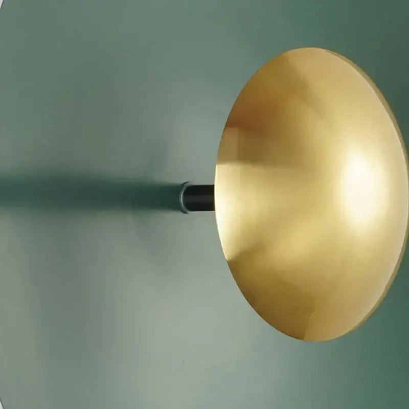 Gold-colored matte dome wall lamp with sleek black stem from set of 5 decorbites colorful round metal led wall lamps