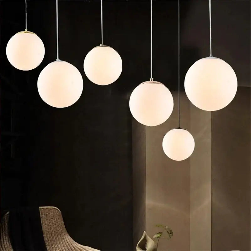 Set of five frosted glass ball pendant lights with slender metallic cords for living room decorbites glass ball pendant