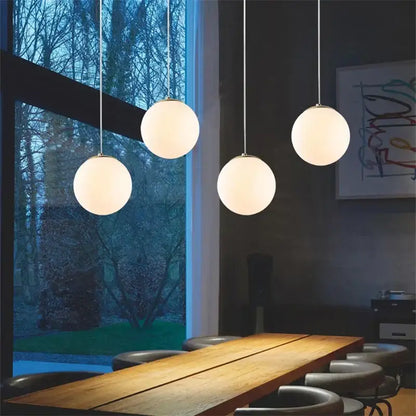 Four frosted glass ball pendant lights hang from metallic cords in set of 6 decorbites glass ball pendant lights for living room
