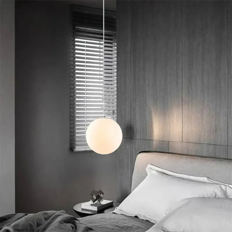 Set of 6 frosted glass ball pendant lights with minimalist spherical design and thin metal suspension for living room decor