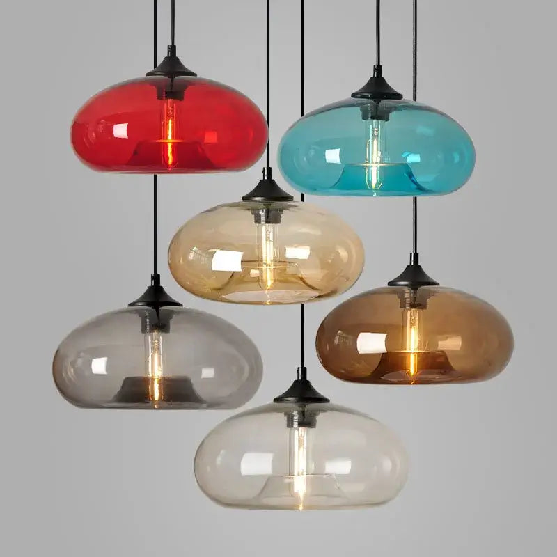 Set of five colorful glass pendant lights with black metal fixtures and exposed filament bulbs for dining room decorbites colorful glass pendant