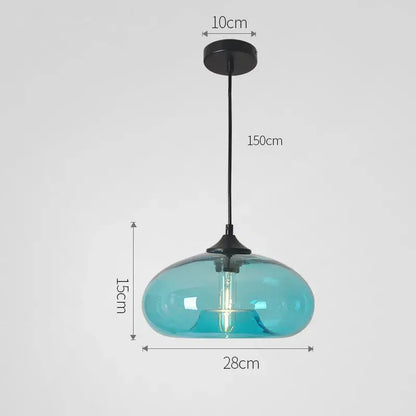 A sleek translucent turquoise decorbites colorful glass pendant light with black metal fixture for dining room use