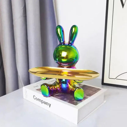 Iridescent colorful rabbit storage box on a gold tray sitting atop a book by decorbites colorful rabbit collection