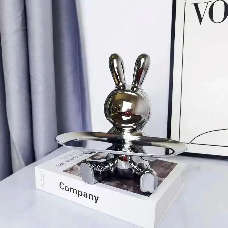 Shiny chrome storage box with colorful rabbit figurine on reflective tray base for decorbites colorful rabbit display