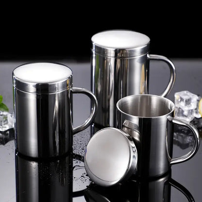 Shiny stainless steel double wall coffee mugs with lids and sturdy handles featuring a reflective finish for travel use