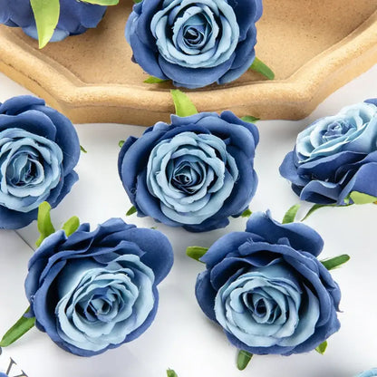 Silk blue artificial flowers featuring layered petals and green stems, ideal for wedding party decor and bedroom rose arrangements