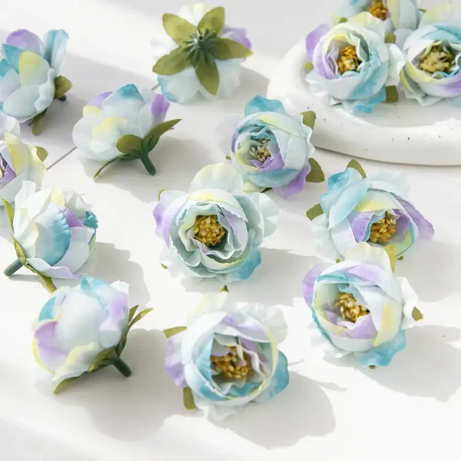 Silk peony flower collection featuring pastel blue lavender and white artificial peonies with yellow centers for decor