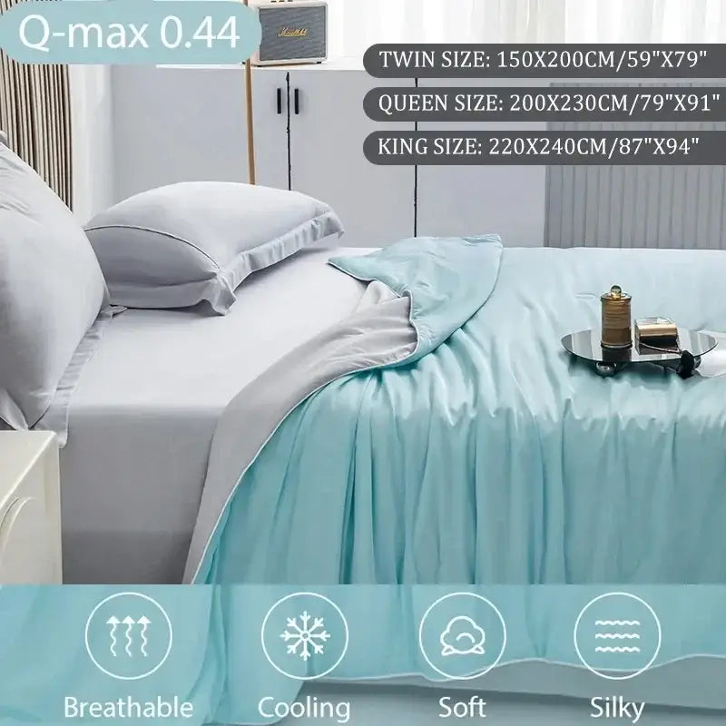 Light blue silky quilted cooling queen quilt with subtle ruffled edge ideal for summer bedroom comfort