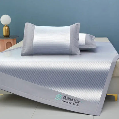 Light gray antibacterial cooling sheet with subtle stripes and embroidered branding by decorbites cooling sheet