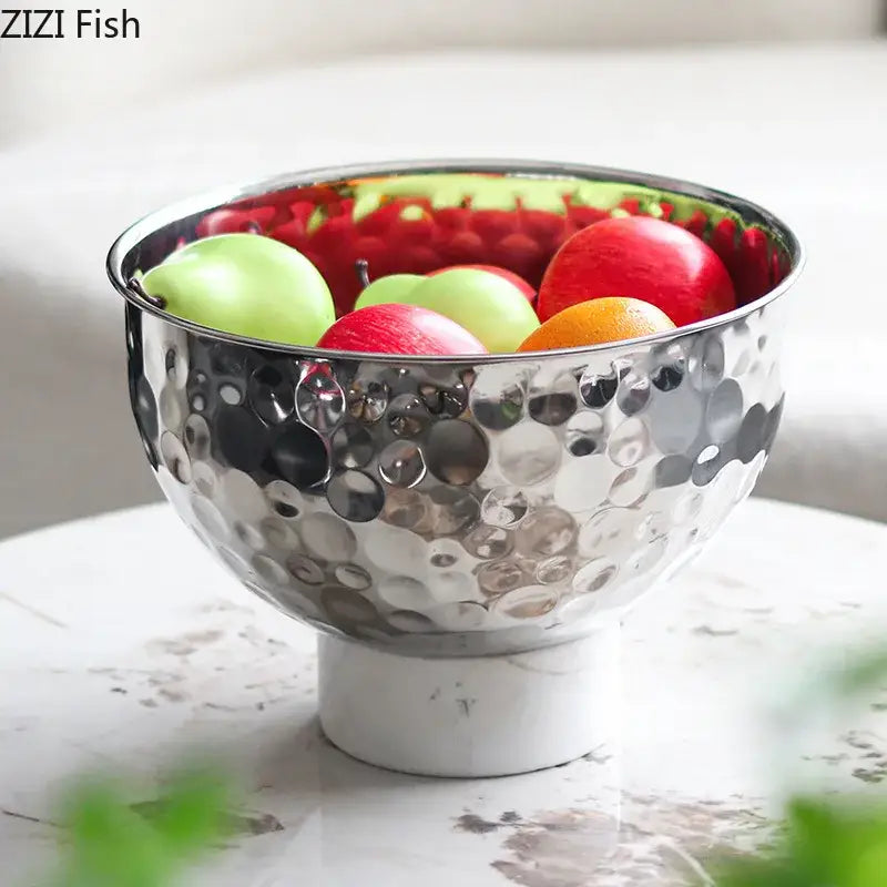 Silver hammered metal fruits bowl with hammer pattern and white marble pedestal base for dining room use