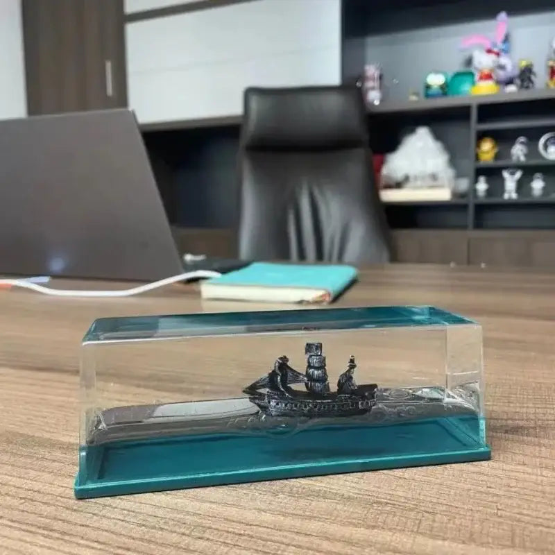 Black pearl pirate ship miniature model encased in clear glass display with teal liquid base for office decorbites decor