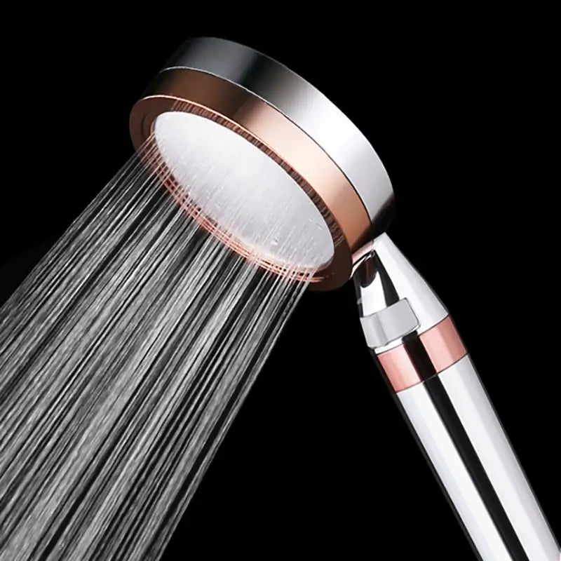 A sleek modern shower head with polished chrome finish and rose gold accents enhancing decorbites 10cm panel shower experience