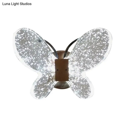 Silver butterfly crystal wall sconce with translucent speckled glass wings and bronze base direct wired electric power source