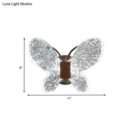 Silver butterfly crystal wall sconce with translucent speckled glass wings and bronze base direct wired electric power source