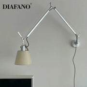 Silver and cream wall lamp with long swing arm and cream fabric shade for adjustable bedroom reading light decorbites