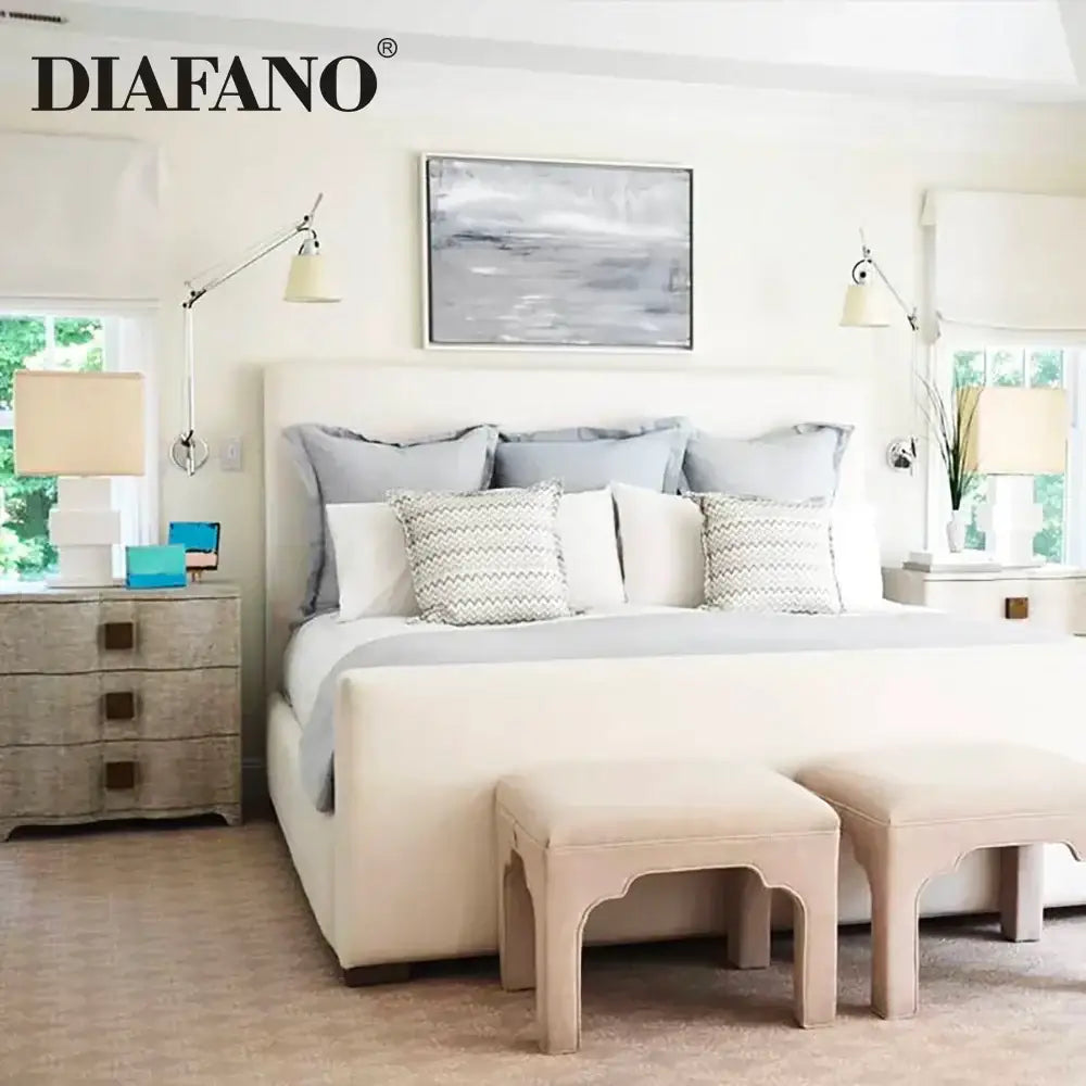 Cream-colored upholstered bed with tufted headboard and footstools paired with silver cream long swing arm wall lamp decorbites adjustable