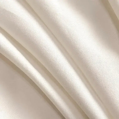 Soft off-white silk fabric with smooth texture and subtle sheen in silver floral embroidery white bedding set decorbites cotton king