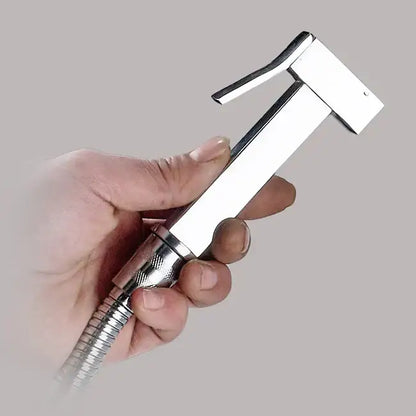 Silver and golden bidet sprayer with chrome finish, textured grip, and flexible hose for bathroom use decorbites golden bidet
