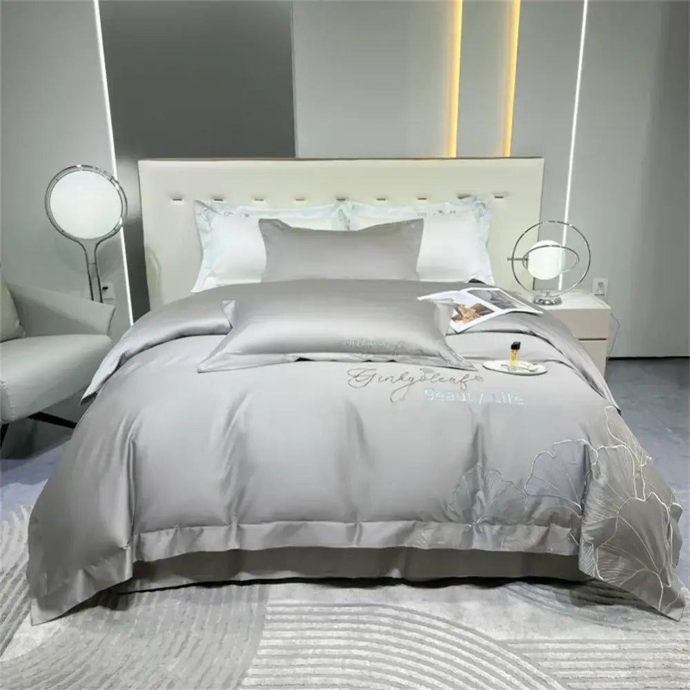 Silver gray satin duvet cover bedding set with delicate floral embroidery and script detailing decorbites 1200tc embroidery egyptian cotton
