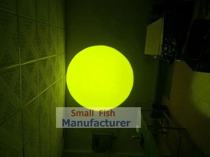 A glowing yellow spherical light fixture mounted on a tiled wall in a silver metal 300w led follow spot light design