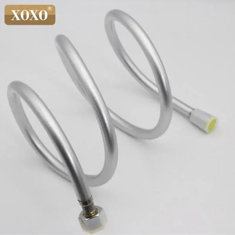 Silver pvc flexible shower hose with metallic spiral connectors and yellow-tipped end by xoxo for bathroom use