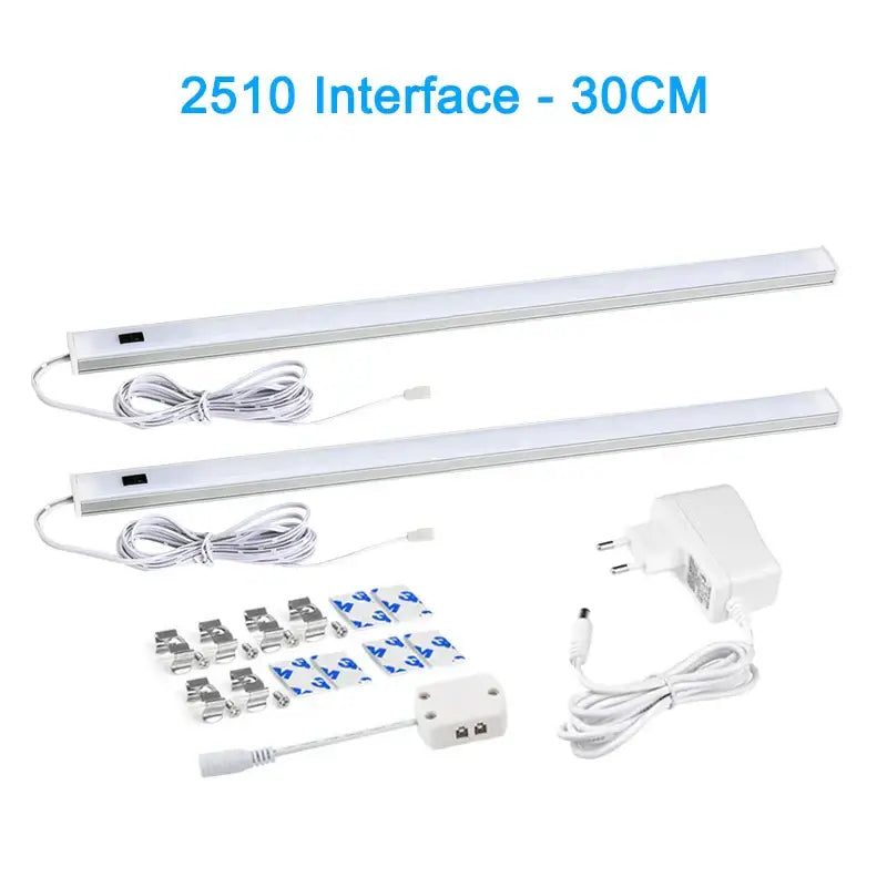 Two sleek white pir motion sensor cabinet lights with integrated cords and mounting hardware for living spaces