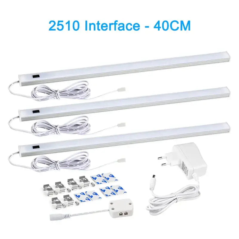 Three white led strip cabinet lights with pir motion sensor and mounting hardware for use in living spaces and kitchens