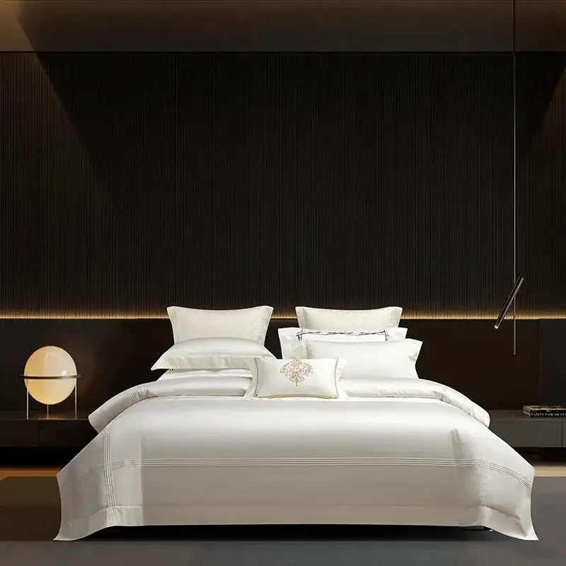 White satin bedding set with subtle gold embroidery on central pillow from decorbites 1000tc egyptian cotton collection
