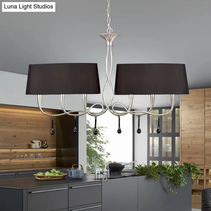 Silver twisted metal island chandelier with two black rectangular shades and teardrop pendants for dining room