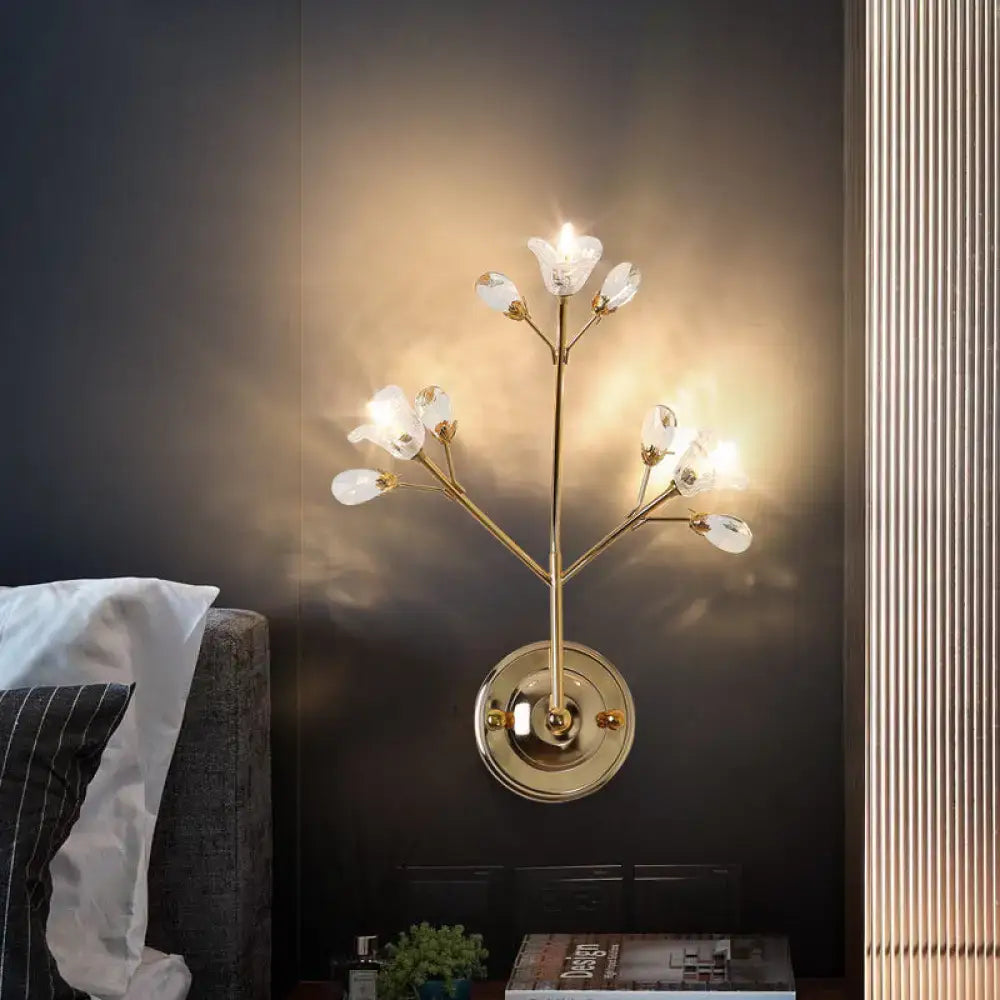 Simple gold crystal flowers wall sconce with delicate branch-like arms and clear crystal flower light fixtures for bedroom