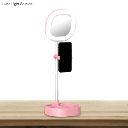Pink led mirror light with phone holder and sleek plastic design for bedroom vanity and simple lighting