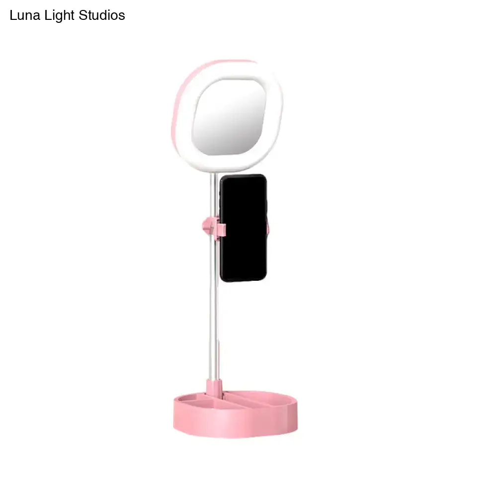 Pink and white led mirror light vanity with phone holder designed for bedroom use