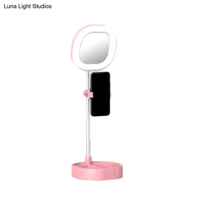 Pink and white led mirror light vanity with phone holder designed for bedroom use
