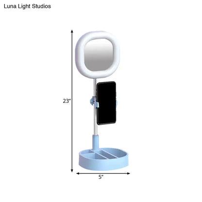 Light blue plastic vanity led mirror light with circular ring light and phone holder for bedroom use