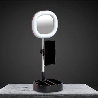 A sleek modern vanity led mirror light with white ring light and black base featuring a phone holder for bedroom use