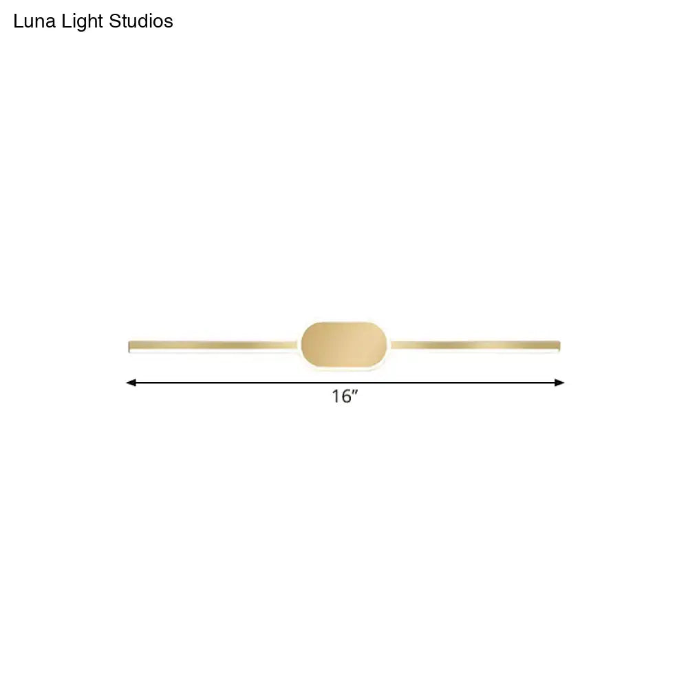 Gold-toned simple style wall mounted vanity sconce with minimalist linear LED design and central oval accent
