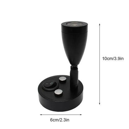 Sleek black adjustable led reading lamp with circular base and silver buttons for rv and bedroom interior use