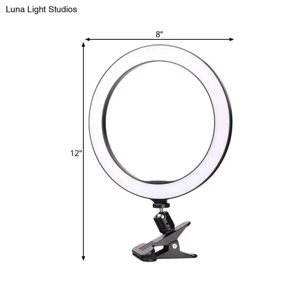 Sleek black led ring wall light with bright white color temperature and 12-inch fixture height clip base