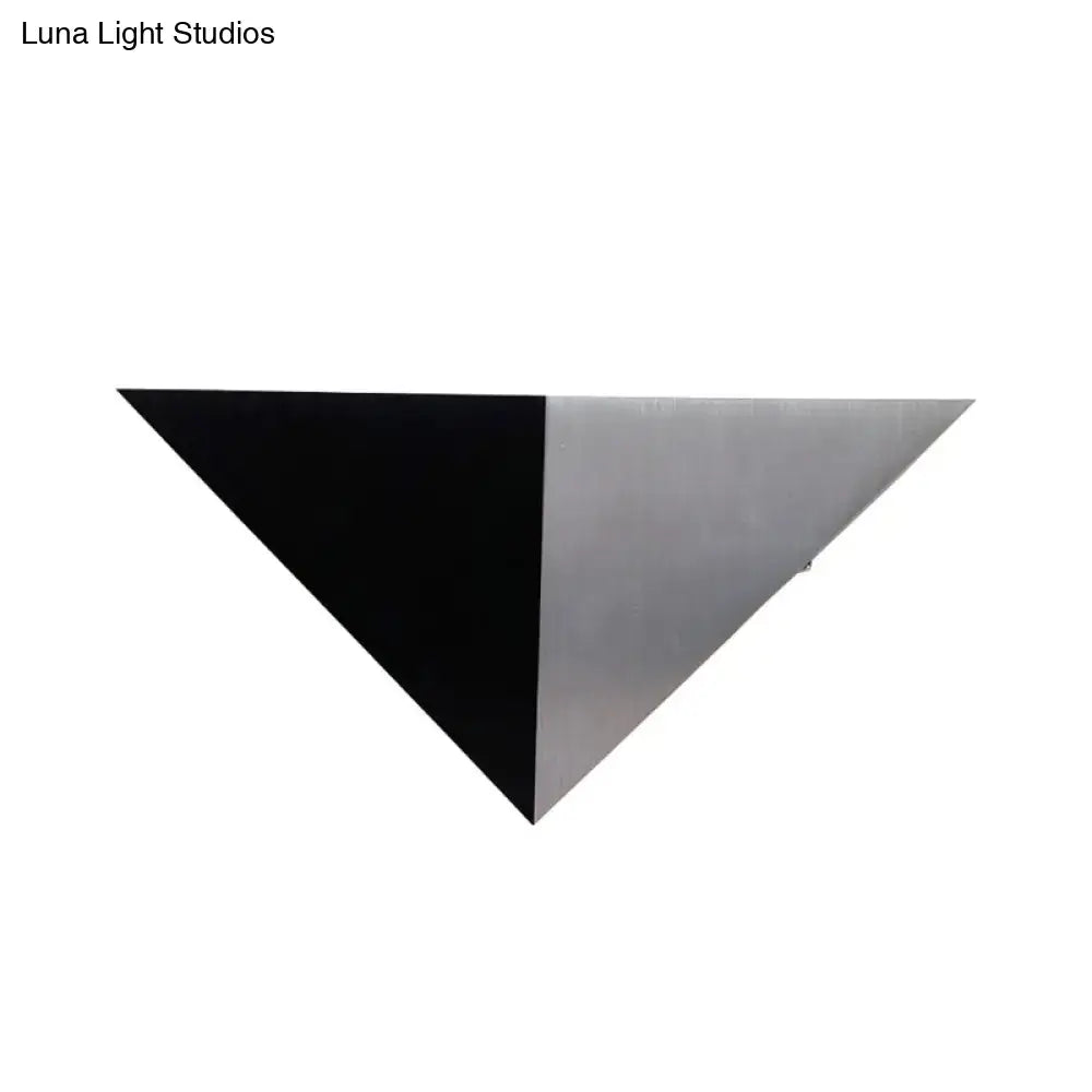A sleek black triangular wall lamp with brushed silver metallic finish modern inch fixture for living room lighting