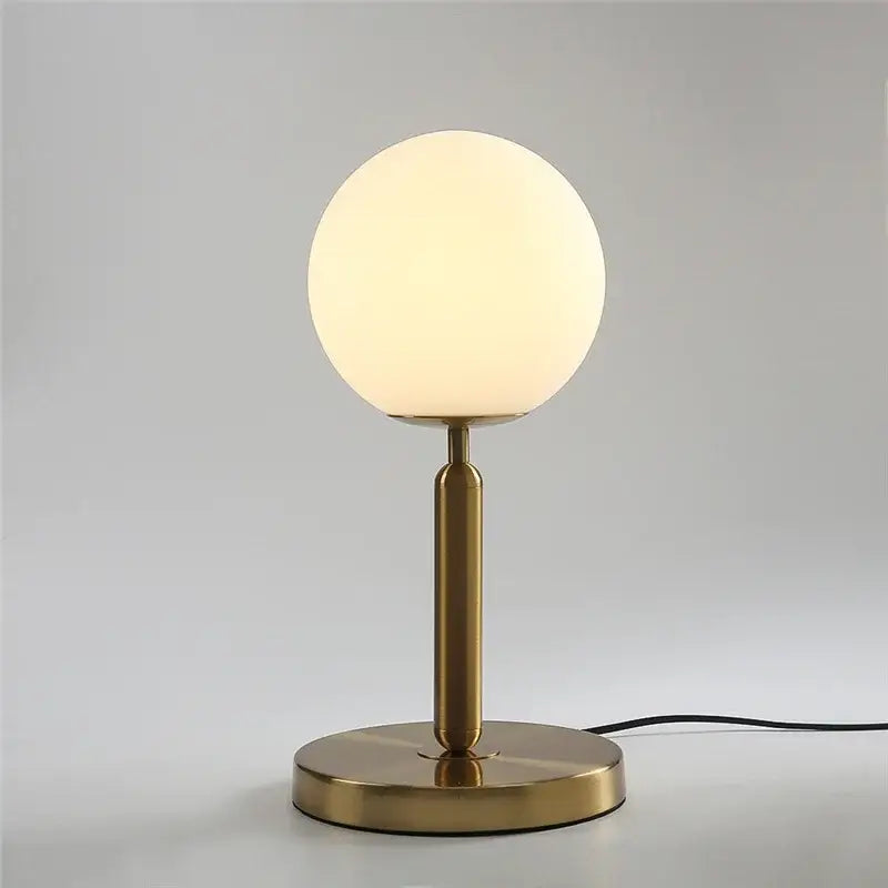 A sleek brass glass ball table lamp with frosted shade ideal for bedroom decorbites glass ball collection